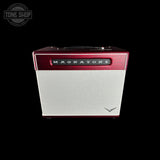 A vintage-style Magnatone guitar amplifier with a textured red top and a brushed silver front grille, shown against a solid black background. A Tone Shop watermark is visible in the upper left corner.