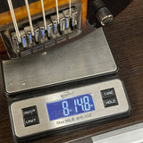Digital scale displaying weight on a wooden surface