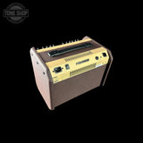 Fishman acoustic guitar amplifier on a black background with 'Tone Shop' logo.