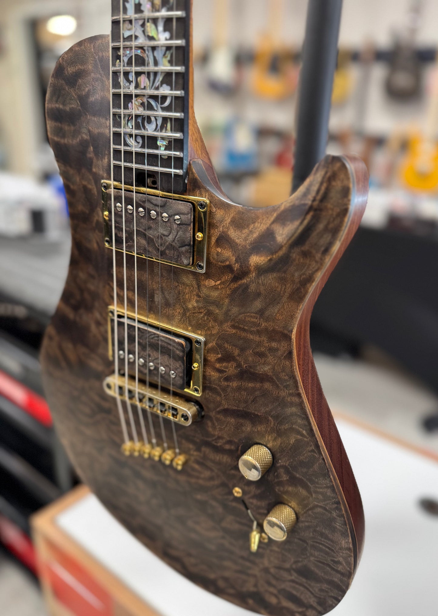 Left side of Used Warrior King's Closet Isabella Guitar w/Burl top w/Vine of Life w/Bag TSS6756