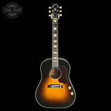 Acoustic guitar with a sunburst finish on a black background, featuring the Gibson logo.