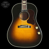 Acoustic guitar with a sunburst finish on a black background, featuring the Tone Shop logo.