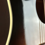 Close-up of an acoustic guitar's soundhole and body