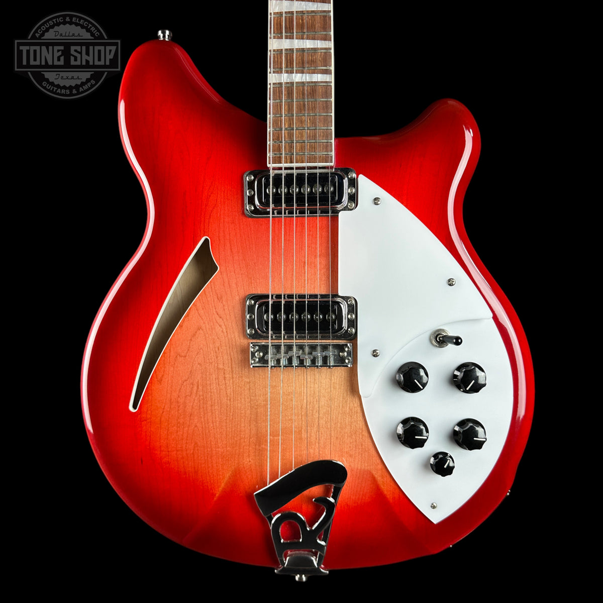 A Ricken electric guitar with a red-to-brown sunburst finish, featuring a white pickguard, black hardware, and a maple fretboard, shown against a black background with a Tone Shop watermark.