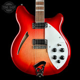 A Ricken electric guitar with a red-to-brown sunburst finish, featuring a white pickguard, black hardware, and a maple fretboard, shown against a black background with a Tone Shop watermark.