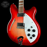 A red and orange sunburst electric guitar with a white pickguard, shown against a solid black background. The brand logo 'TONE SHOP' is visible in the top-left corner.