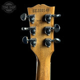 Guitar headstock with tuning pegs on a black background, featuring 'Tone Shop' logo.