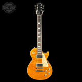 Electric guitar with a sunburst finish on a black background, featuring the Tone Shop logo.