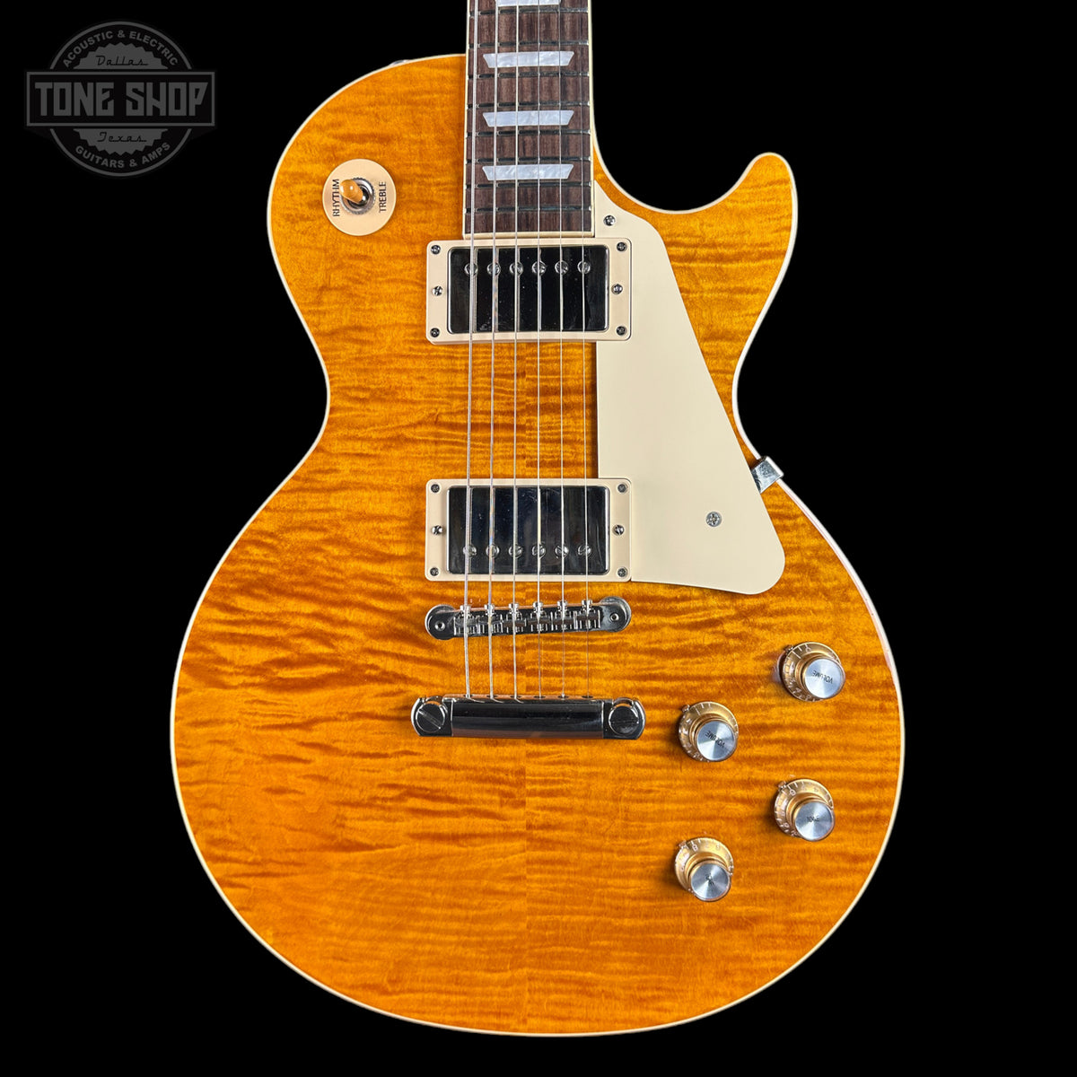 Electric guitar with a sunburst finish on a black background, featuring the Tone Shop logo.