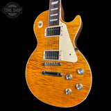Electric guitar with a sunburst finish on a black background, featuring the Tone Shop logo.