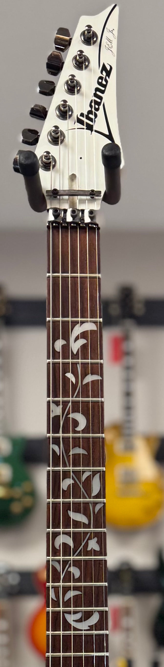 Front of neck of Used 1996 Ibanez JEM555-WH MIK TSS6747