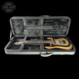 Guitar case with a guitar inside, featuring the Tone Shop logo.