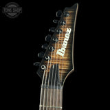 Ibanez electric guitar neck with brand logo on a black background