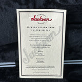 Jackson Custom Shop certificate on a dark textured background