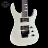 White electric guitar with black pickups on a black background, featuring 'Tone Shop' logo.