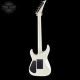 White electric guitar with black pickguard on a white background