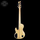 Wooden bass guitar on a black background with 'Tone Shop' logo.
