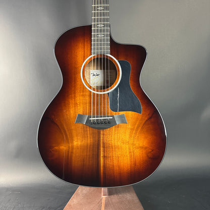 Acoustic guitar with a sunburst finish on a gray background