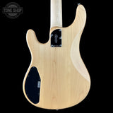Back view of a bass guitar with 'Tone Shop' logo.