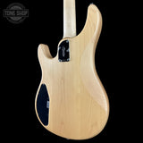 Back view of a electric guitar with 'Tone Shop' logo in the corner.