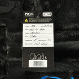 A product tag for aPRS Microphones Model MTW-1000 Cardioid Cardi with a handwritten white label on a black fuzzy fabric background.