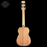 Back view of a ukulele with 'Tone Shop' branding on a black background
