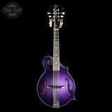 A purple metallic-finish mandolin guitar centered on a black background, with a visible Tone Shop watermark in the upper left corner.