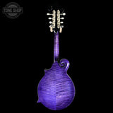 A purple mandolin with a highly figured maple wood finish, shown from the back against a solid black background. A Tone Shop watermark is visible in the top left corner.