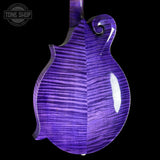 Close-up of the back of an electric mandolin with a glossy purple flamed maple top, showing the natural wood grain pattern against a black background.