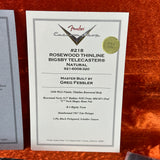 Fender Custom Shop Rosewood Thinline Bigsby Telecaster certificate on a wooden surface