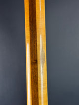 Wooden object with a dark gray background