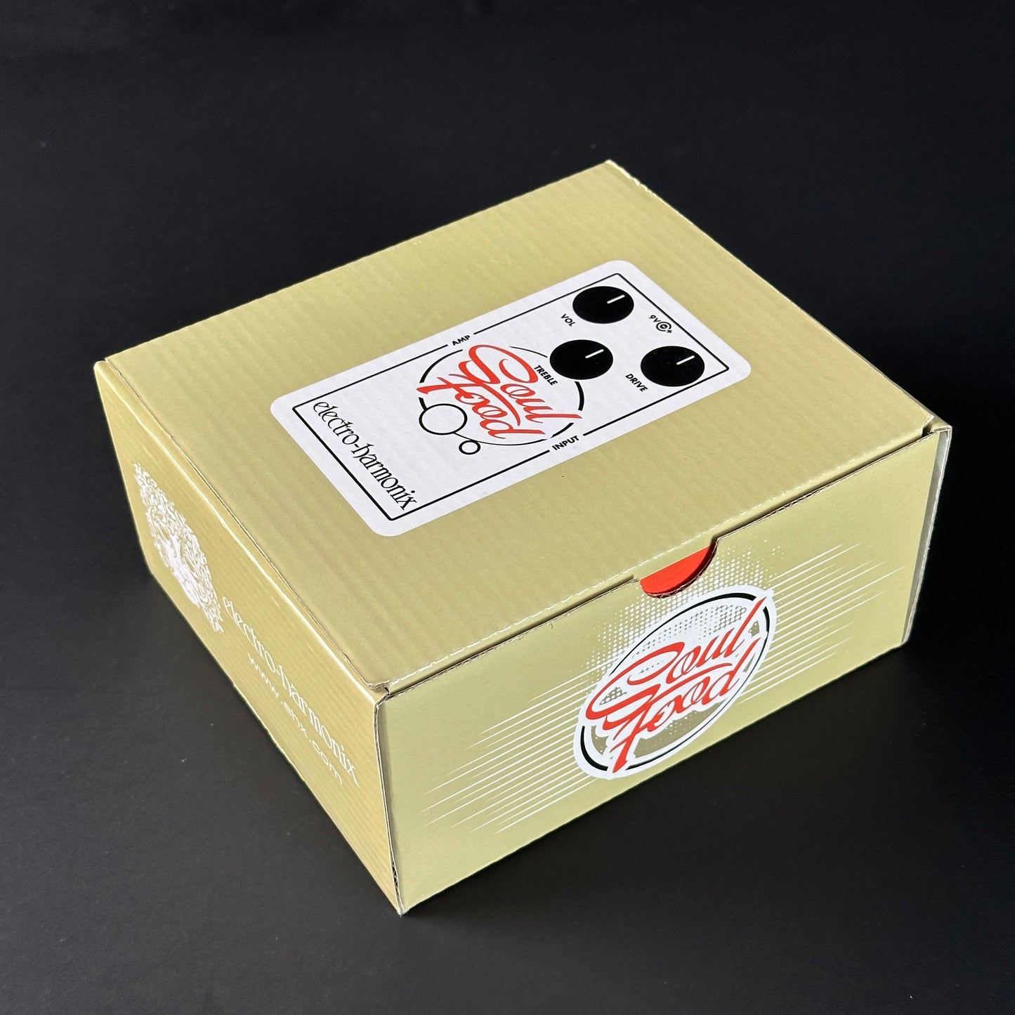 Beige product box with a label on a black background