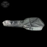 Gray guitar case with a visible brand logo on a black background