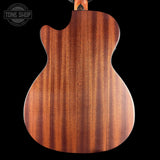 Wooden guitar body with a visible brand logo in the corner.