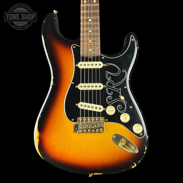 Fender Stratocaster guitar with a sunburst finish on a black background, featuring the Tone Shop logo.