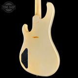 Back view of a cream-colored electric guitar with 'Tone Shop' logo in the corner.