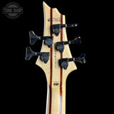 Close-up of a guitar headstock with tuning pegs on a black background, featuring the ESP brand.