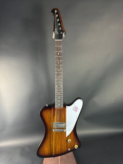 Guitar with a brown and white design on a gray background