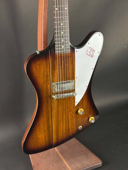 Electric guitar with a sunburst finish on a dark background