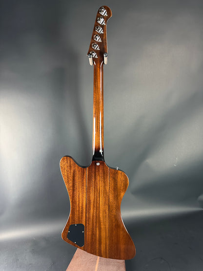 Wooden electric guitar body on a gray background