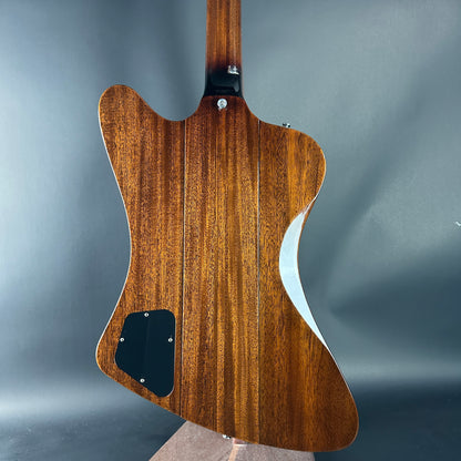 Wooden guitar body on a gray background