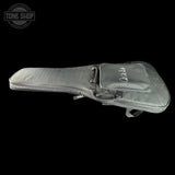 Gray guitar case with 'PRS' branding on a black background