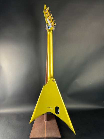Yellow electric guitar neck on a dark background