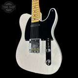 White electric guitar with a black pickguard on a black background, featuring the Tone Shop logo.