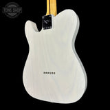 White electric guitar body with 'Tone Shop' logo in the corner