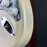 Wear on bottom edge of Used 1999 Fender Standard Stratocaster White.