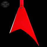 A bright red, V-shaped guitar headstock or decorative sign with a glossy finish, shown against a solid black background. A circular 'TONE SHOP' watermark is visible in the top-left corner.
