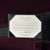 Certificate of authenticity for a Martin Custom Shop guitar on a dark background