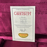 Gretsch Certificate of Authenticity on a purple velvet surface