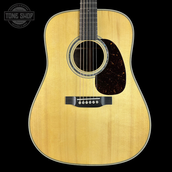 Acoustic guitar with a visible brand logo in the corner
